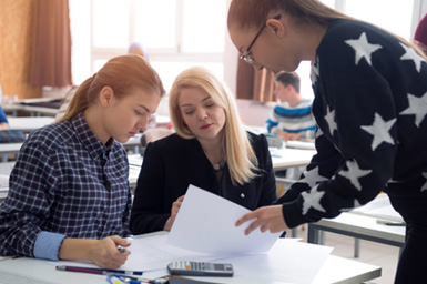 Students reviewing the academic calendar