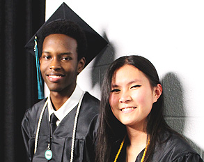 Two graduates at Commencement