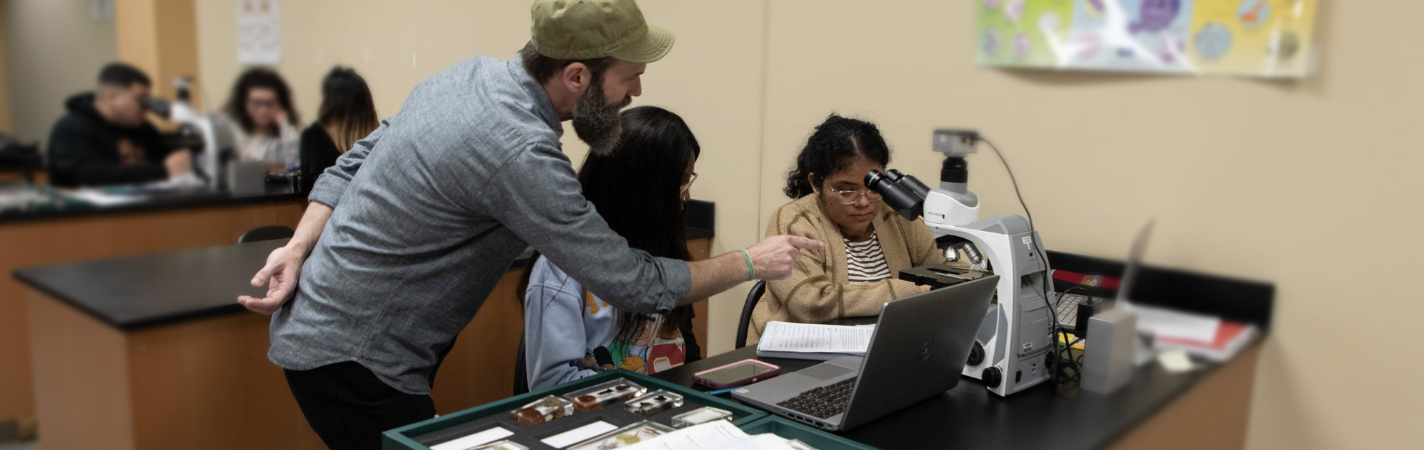 Students in Biology class with professor.