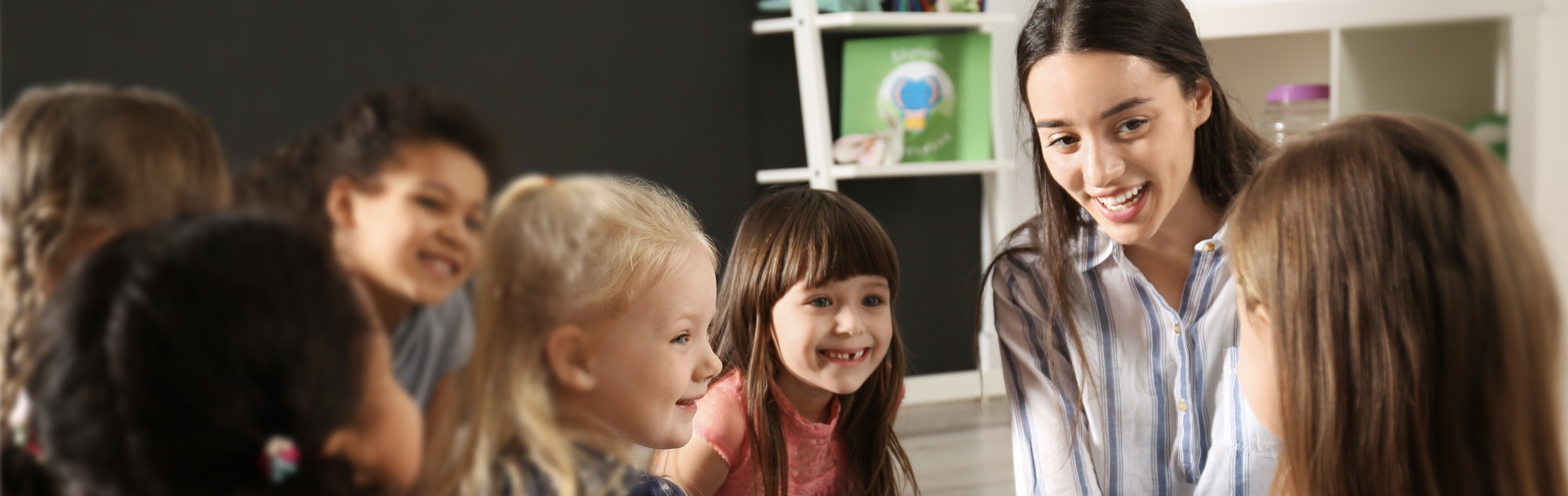 Student teacher with pre-school children