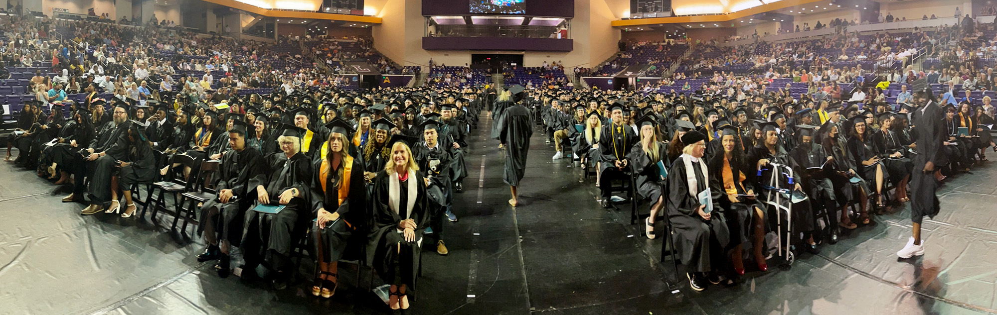 Commencement exercise with graduates, faculty, and guests