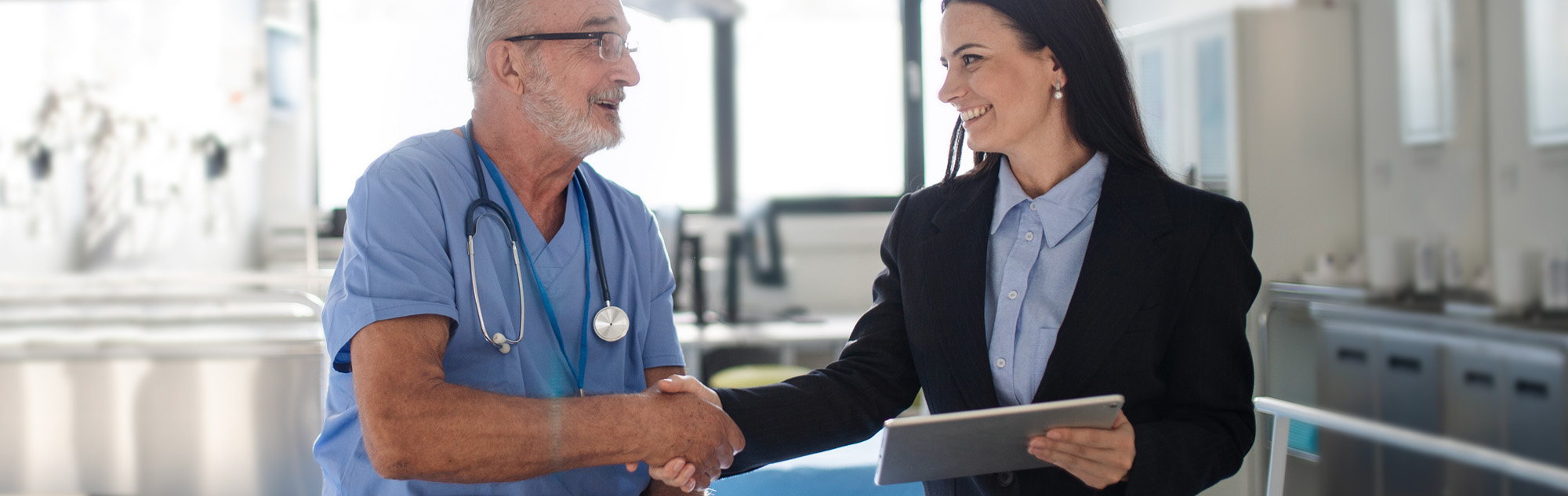 Healthcare manager works with physician.