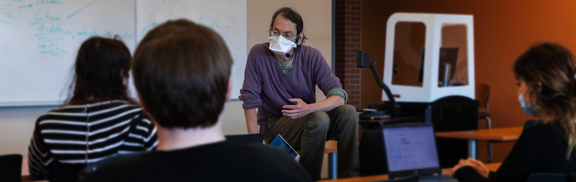 History professor interacts with students.