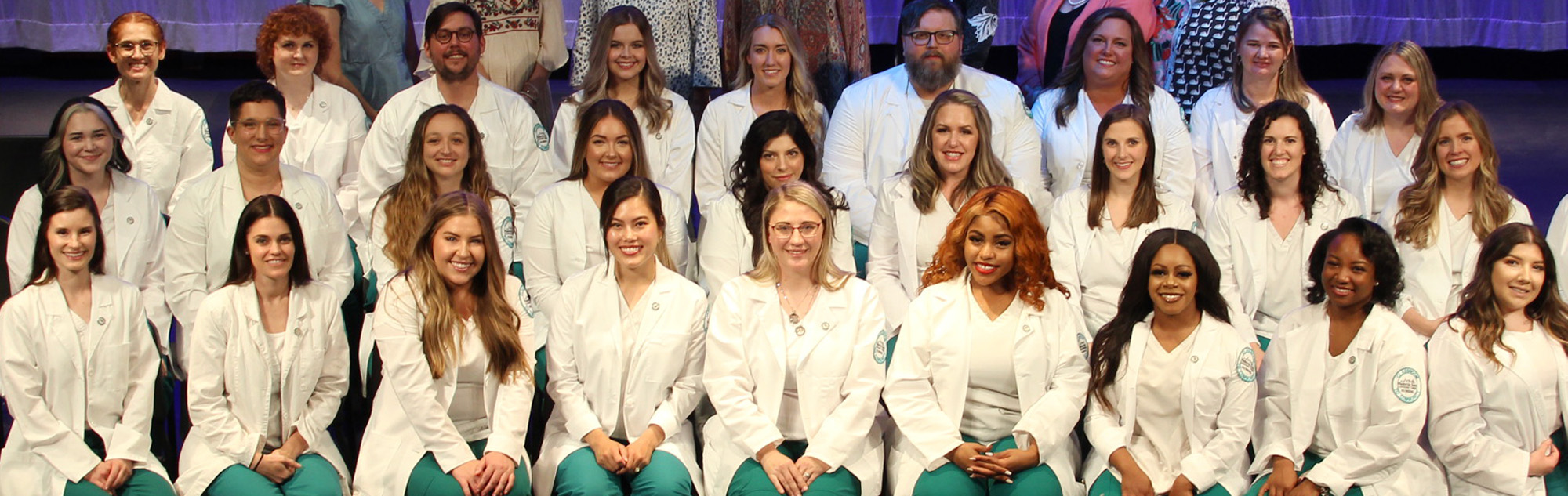 Nursing graduates pose for a group photo.