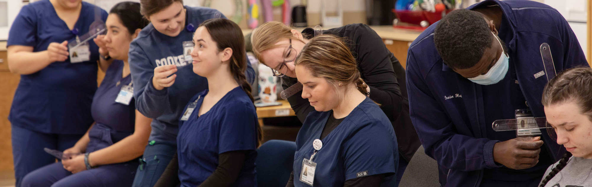 Occupational therapy assistant students learn new skills.