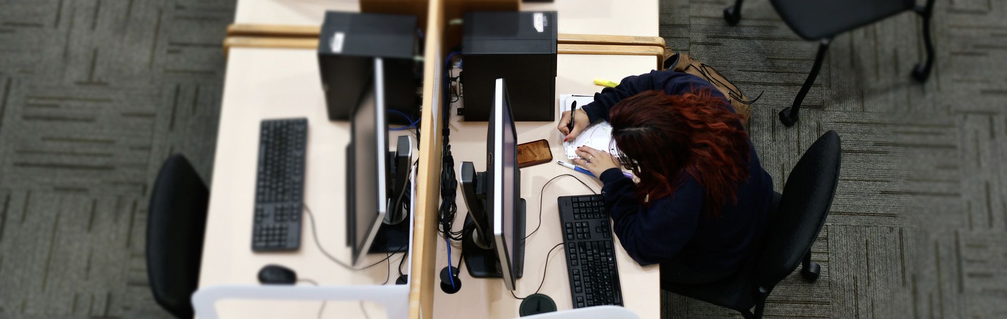 Overhead point of view of female student in library