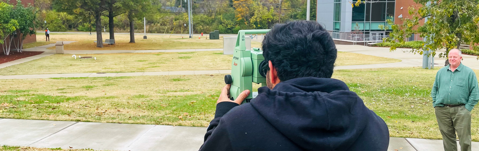 Student learns land surveying skills.